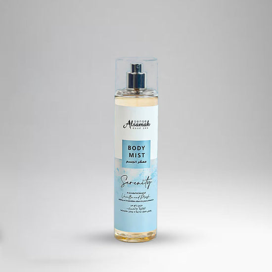 Body mist bottle with a label on a gray background