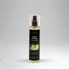 Body splash spray bottle with a black label on a gray background