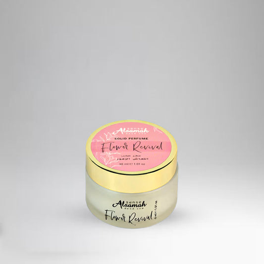 Perfume jar with pink label on a gray background