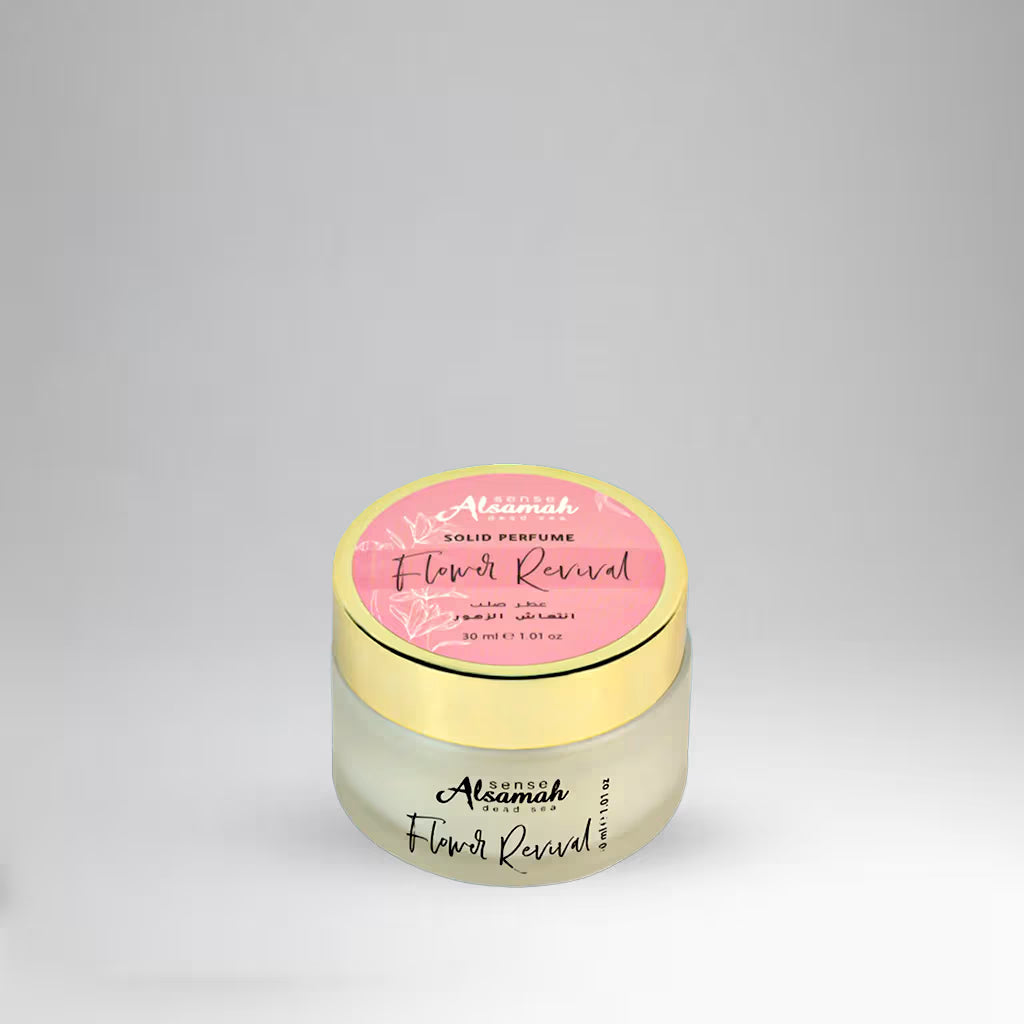 Perfume jar with pink label on a gray background