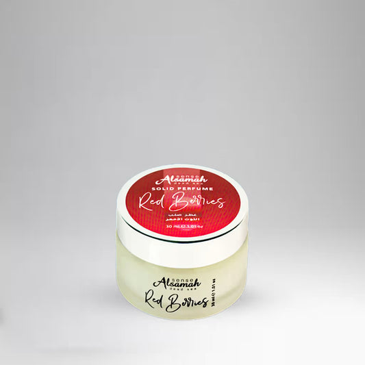 Solid perfume container with red label on a gray background