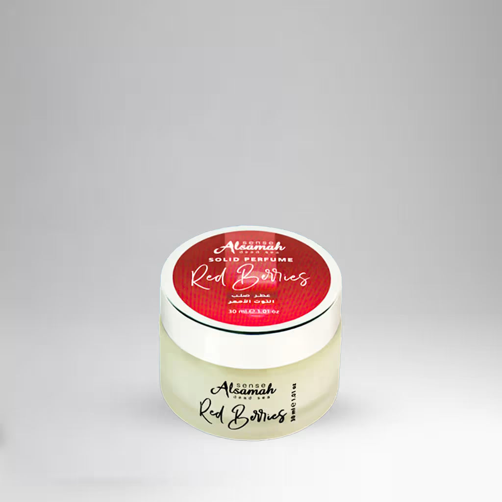 Solid perfume container with red label on a gray background